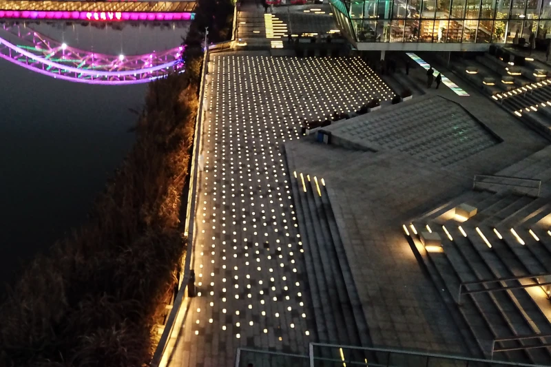 Commercial hardscape lighting with luminous paving stone